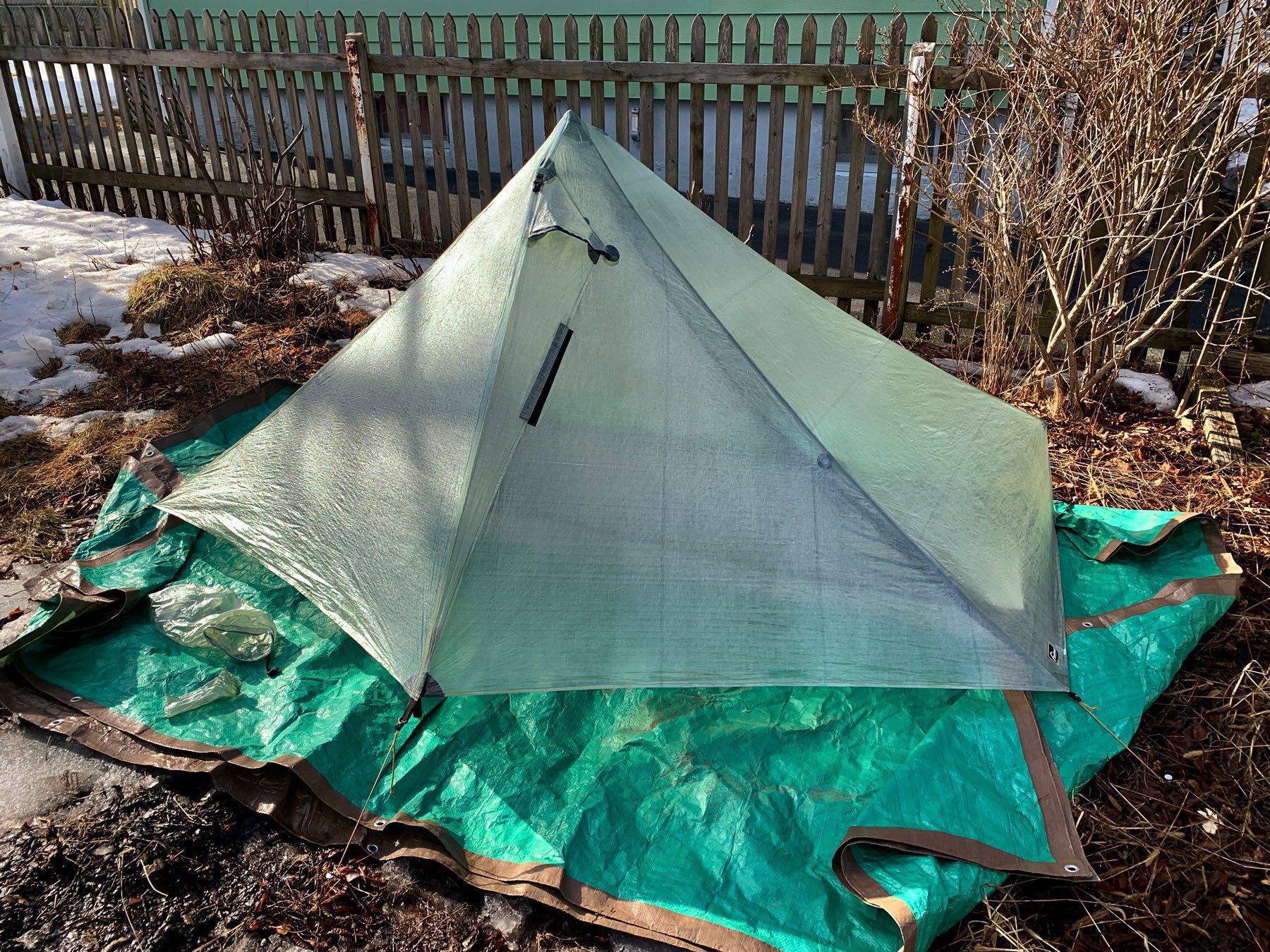 A tent in a backyard